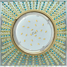 Ecola GX53 H4 Glass Квадрат с прозр. и бирюз.страз. (оправа золото)фон зерк./центр золото 40x123х123